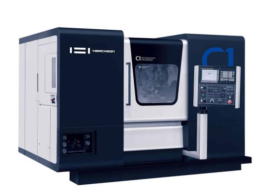 En industriell hurco cnc-maskin med ett stängt fack och en digital kontrollpanel till höger.
