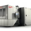 En stor industriell CNC-maskin märkt "Heckert T45" med kontrollpanel och säkrat skåp, tillverkad av Starrag.